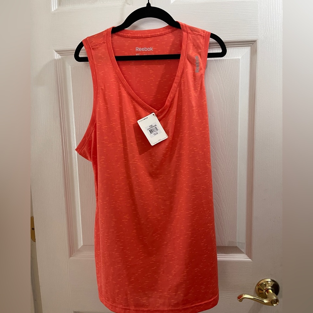Two Reebok Sport Tank tops, sleeveless, With tags, never worn.
